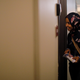 U.S. Democratic congressional candidate Ilhan Omar "door knocks" to encourage voters to cast ballots in the midterm elections in Minneapolis, Minnesota, U.S., October 26, 2018. Picture taken October 26, 2018.